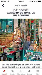 a man is standing in a book store at Maison à El Omrane . in Tunis