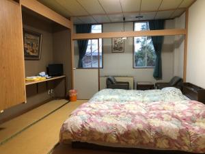 Postel nebo postele na pokoji v ubytování Petit Hotel Yukikkoso