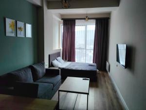 TV a/nebo společenská místnost v ubytování Tsaghkadzor Kechi Apartment 136