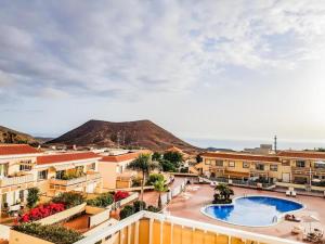 a view from the balcony of a resort with a swimming pool at Lovely Apartment in Tenerife South in Chayofa