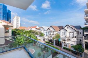 an apartment balcony with a view of buildings at Minh Phước Villa 12 Kim Ngân in Vung Tau