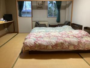 Postel nebo postele na pokoji v ubytování Petit Hotel Yukikkoso
