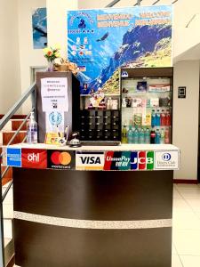 a counter in a store with a drink cooler at Arum Qurpawasi Hospedaje in Cabanaconde