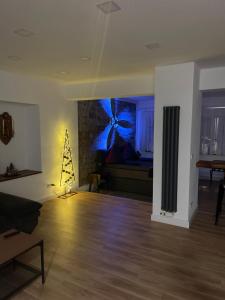 a living room with a christmas tree in a room at Propeller Gästehaus EG in Eppingen