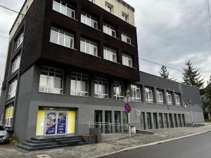 a large building on the side of a street at Komfortowy Apartament w centrum in Jaworzno