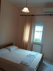 A bed or beds in a room at Irini's Appartment 2