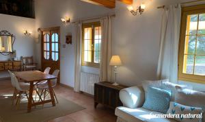 a living room with a couch and a table at Casa Reme Sant Francesc - Formentera Natural in Sant Francesc Xavier