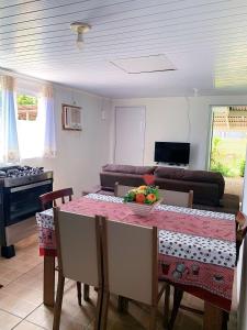 a kitchen with a table with a bowl of fruit on it at Casa da Vila in Porto Belo