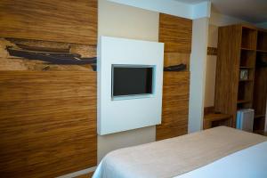 TV o dispositivi per l'intrattenimento presso Linhares Design Hotel