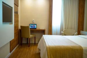 TV o dispositivi per l'intrattenimento presso Linhares Design Hotel