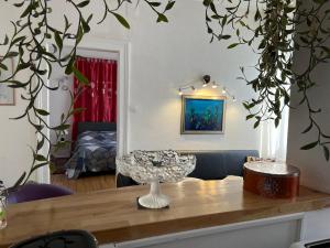 a table with a bowl on top of a table at Appartements chez Tante Germaine - Proximité Institutions Européennes in Strasbourg