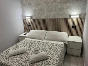A bed or beds in a room at Les Artes