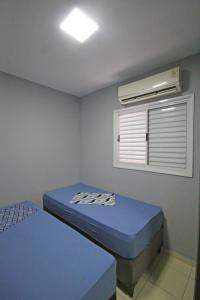 Кровать или кровати в номере Recanto World Point 2