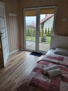 Posteľ alebo postele v izbe v ubytovaní Apartamenty pod Wilczakiem