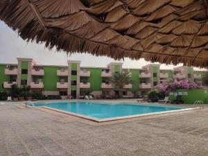 a swimming pool in front of a resort at Djasal Moradias in Santa Maria