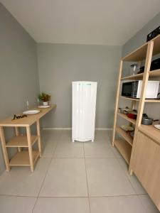 Kuhinja ili čajna kuhinja u objektu Ap 1 quarto e varanda em Ipiabas