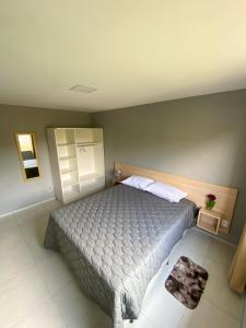 Krevet ili kreveti u jedinici u okviru objekta Ap 1 quarto e varanda em Ipiabas