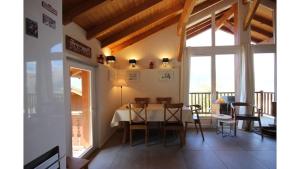 a dining room with a table and chairs at Chalet La Plagne Montalbert 50m des pistes in La Plagne Tarentaise