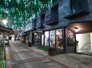 a street with a building with christmas lights at XPT Águeda - Boutique Apartments in Águeda