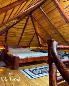 a room with two beds in a attic at Vila Mali Tornik in Zlatibor