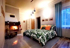 a bedroom with a bed and a fireplace at Dom wakacyjny Chillout Rock in Lwówek Śląski +93 photos