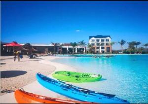 a group of boats on the shore of a beach at Blyde Beach Front Apartment Ground floor in Pretoria