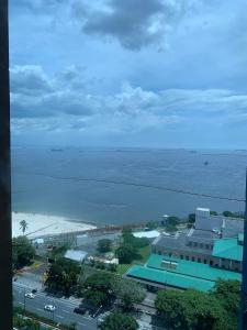 an aerial view of a city and the ocean at US Embassy Roxas Blvd, Ermita, Manila 1 Bedroom ComfySuite in Manila