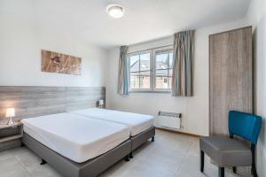 Postel nebo postele na pokoji v ubytování Domek v Podještědí + 4 fotografie