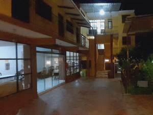 an empty courtyard of a building at night at HOSTAL EDEN in Torotoro