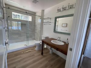 a bathroom with a sink and a shower at Granite Point Resort in Loon Lake