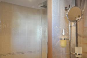 a bathroom with a shower with a mirror at Sea La Vie! in Volos +22 photos