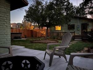 a yard with two chairs and a house at 2min from rt66 hot tub bocceball court firepit in Williams