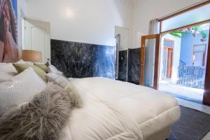 Postel nebo postele na pokoji v ubytování AmazINN Places Casco Viejo Pool and Rooftop VII