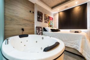 Cama o camas de una habitación en AA212 Studio sofisticado na Bela Vista