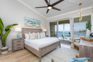 a bedroom with a bed and a view of the ocean at Napili Shores A202 OF Studio condo in Kahana