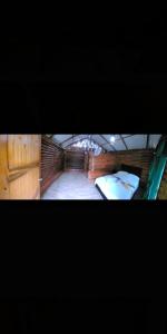 a view of a room with two beds in it at Cabañas orquídea in Norcasia