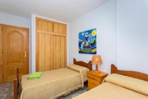 Postel nebo postele na pokoji v ubytování Sensacional piso junto al mar + 17 fotografií