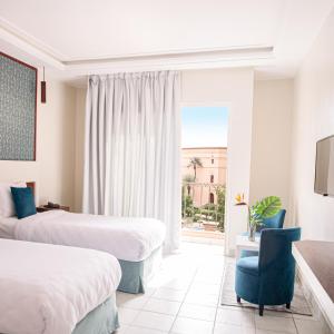 Postel nebo postele na pokoji v ubytování Hotel Safia