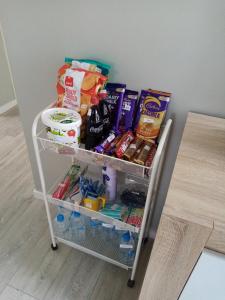 a shelf with food and drinks in a refrigerator at Sunbrae Beach luxury in Mount Maunganui