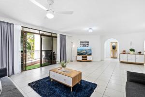 a living room with a couch and a table at Coco Bella Dream in Surfers Paradise in Gold Coast