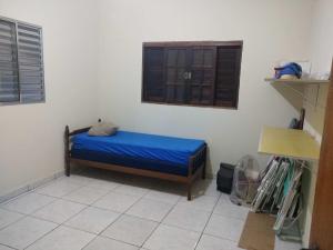 En eller flere senger på et rom på Casa Caraguatatuba - 1km da Praia
