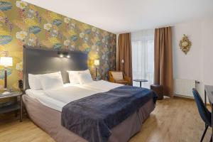 Postel nebo postele na pokoji v ubytování Best Western Plus Hotel Noble House