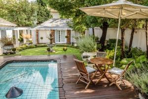 The swimming pool at or close to Touch of Class Guest House