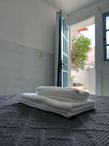a group of towels sitting on top of a table at Casa da Lua Buzios in Búzios