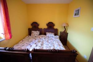 a bedroom with a large bed with white comforter at Holiday home in Dobrnic - Dolenjska & Bela krajina Unter- & Weißkrain 26093 in Dobrnič