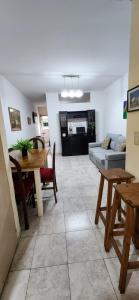 a living room with a table and a couch at Esmeralda Apartment in Buenos Aires