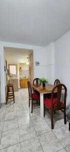 a dining room with a table and chairs at Esmeralda Apartment in Buenos Aires