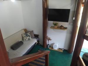 Et tv og/eller underholdning på Chalé Limoeiro á 15 minutos de Gonçalves MG