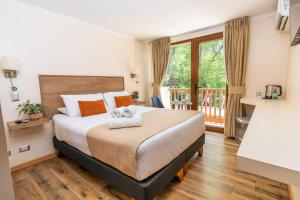 Postel nebo postele na pokoji v ubytování Tagle Hotel Boutique