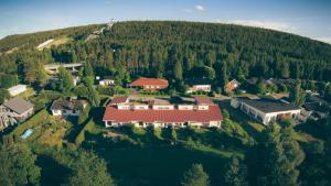 an aerial view of a house in a forest at Arctic Loft Rovaniemi in Rovaniemi